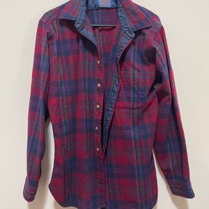 Blue and red pendleton plaid flannel jacket with tan patches on elbows